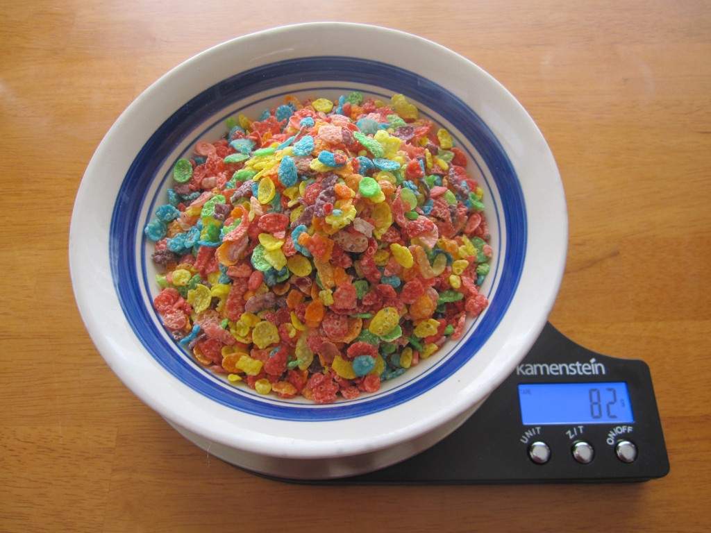 Photograph of Fruity Pebbles in a bowl on a food scale.