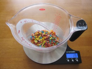 A photograph of Fruity Pebbles in a large measuring cup.