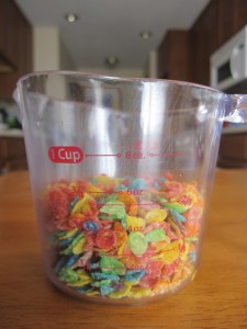 Photograph of Fruity Pebbles in a small measuring cup.