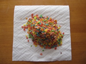 Photograph of fruity pebbles poured onto a paper towel.